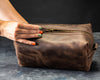 Cognac leather toiletry bags personalized with names Alex, Denis, Nastya