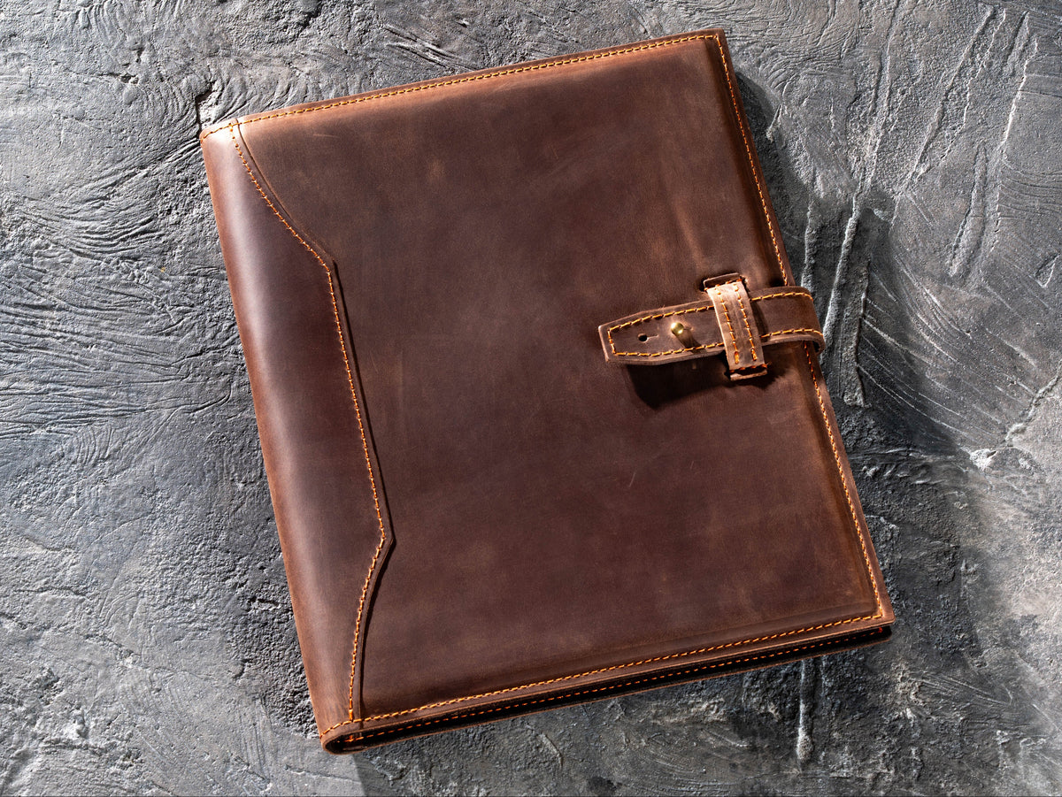 Brown personalized Crazy Horse leather portfolio with strap closure