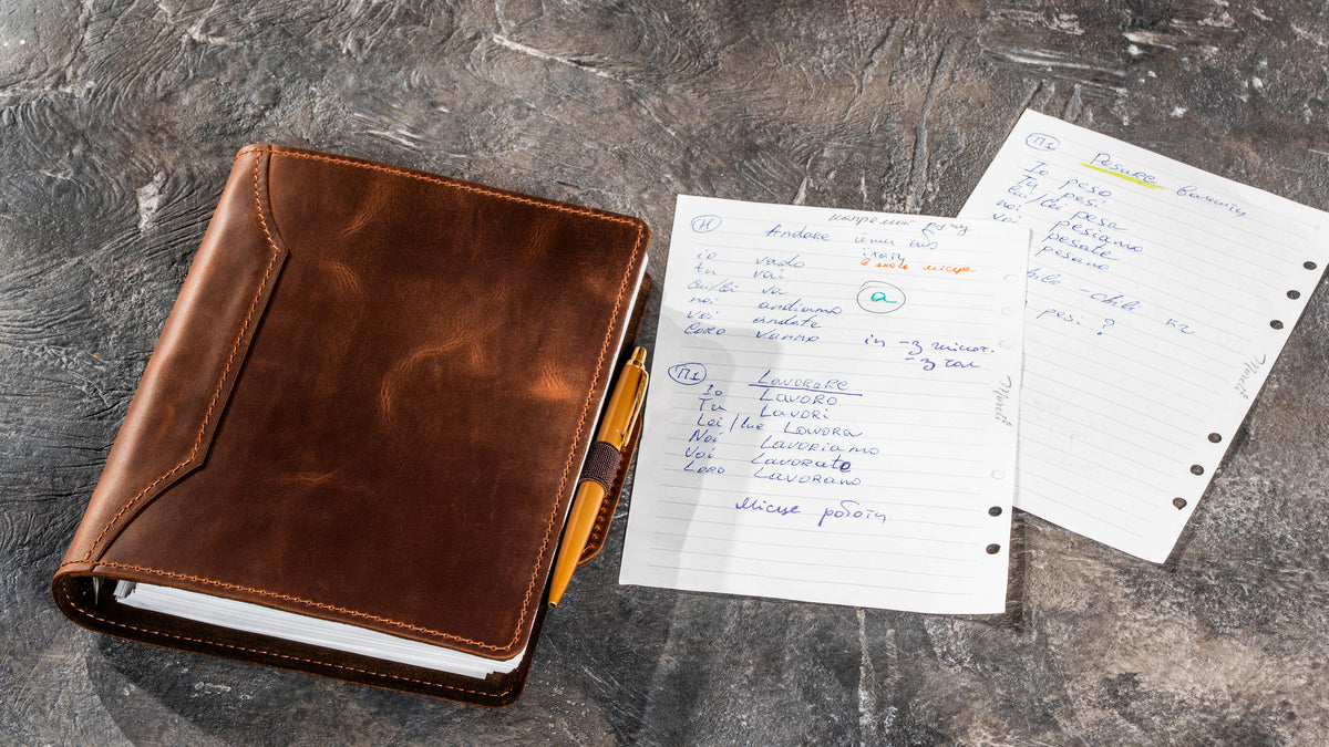 Milk Chocolate refillable leather notebook with pen secured in the elastic pen loop