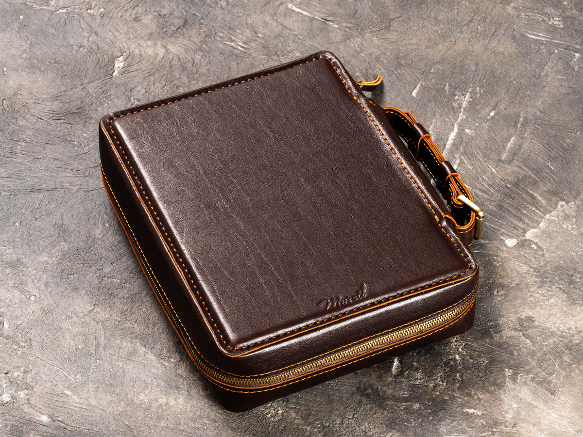 Closed Dark Cognac leather travel organizer case with zip-around closure, carry handle and classic heritage design