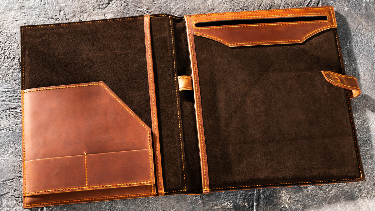 Open Copper leather padfolio with dark brown suede interior, document pockets, card slots and pen loop