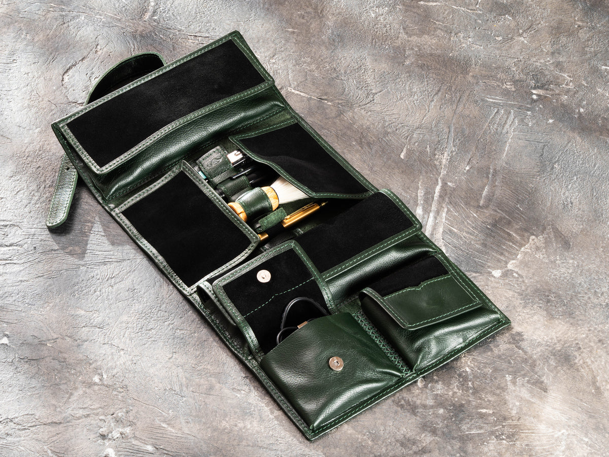Open Dark Green hanging leather travel organizer with magnetic pockets for grooming tools, cables and essentials