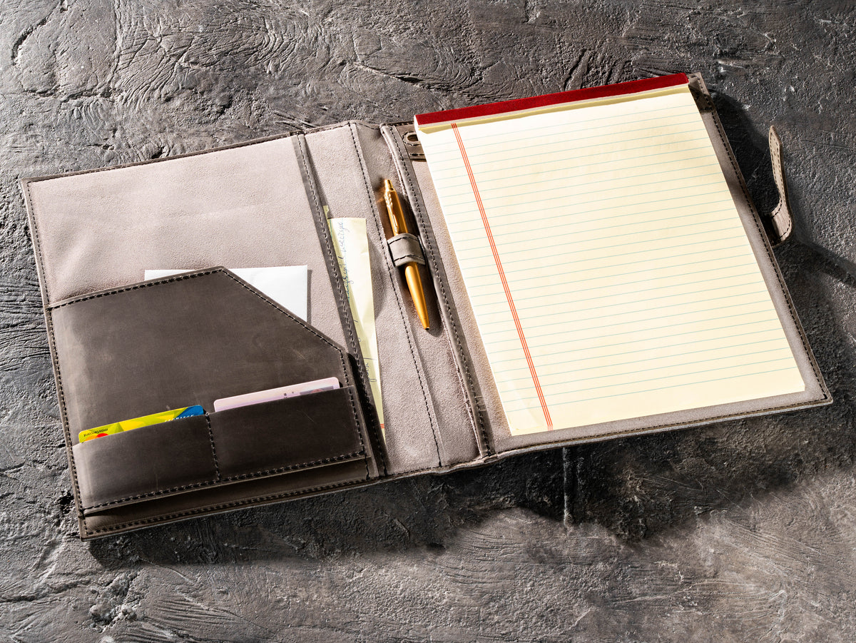 Gray leather business portfolio with 8.5 × 11.75 writing pad, pen and document pockets