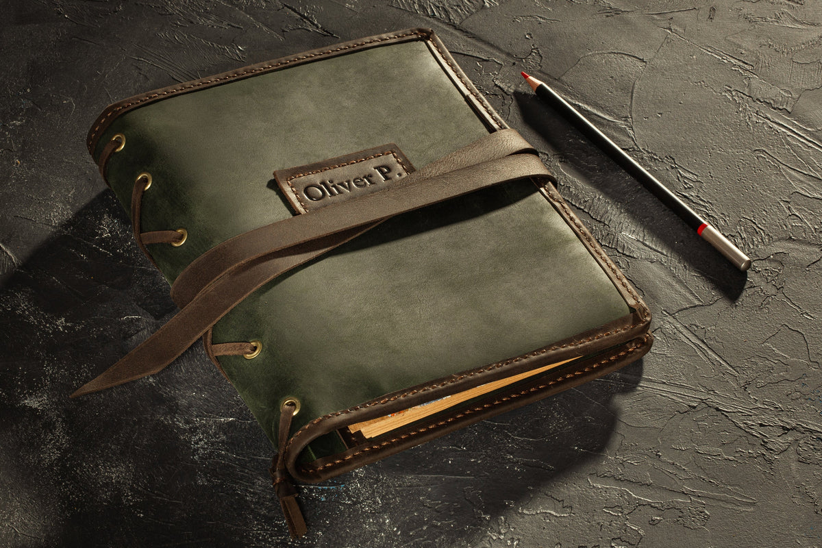 Green and brown leather A5 sketchbook organizer with art pencils, pocket and vertical spiral sketchbook