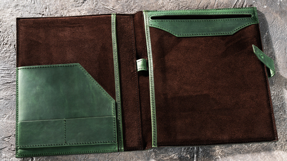 Open Green leather padfolio with brown suede interior, document pockets, card slots and pen loop
