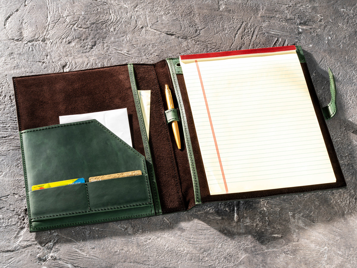 Green leather portfolio with legal pad, pen, documents and business card pockets