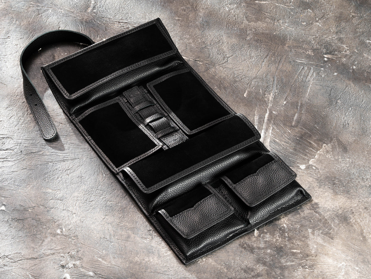 Open black leather travel organizer for men showing magnetic pockets, suede interior and elastic holders