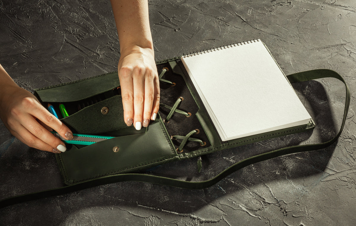 Black and olive green leather A5 sketchbook organizer with pencils, tool pocket and vertical sketchbook