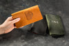 Leather bill folder for hospitality use on dark background