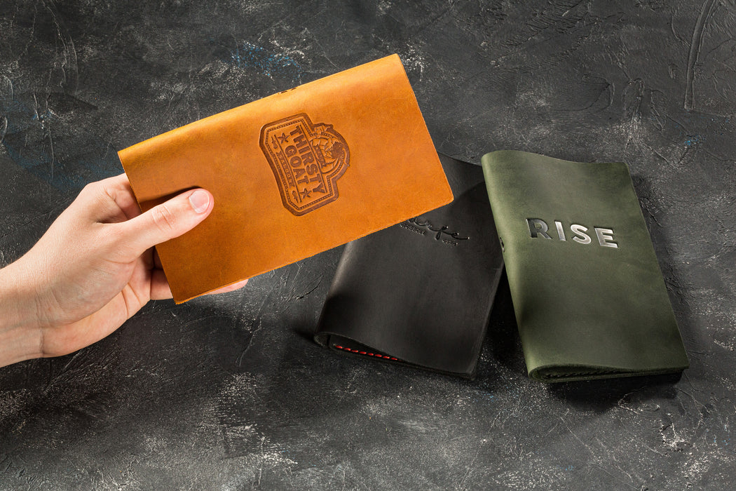 Leather bill folder for hospitality use on dark background