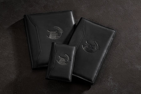Open leather menu cover with printed pages and 3-ring binder mechanism