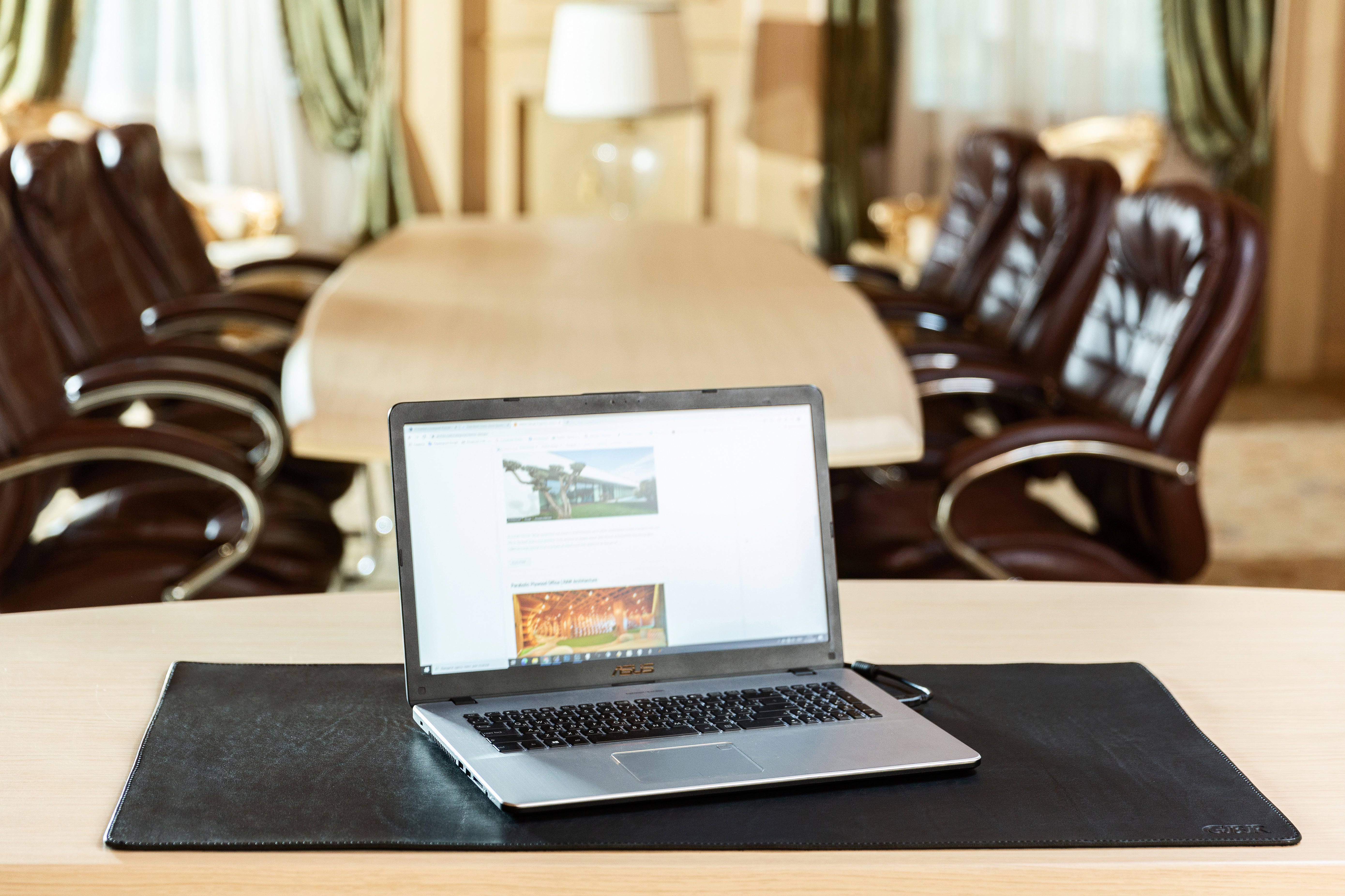 Hand-finished edge detail, premium black leather desk mat