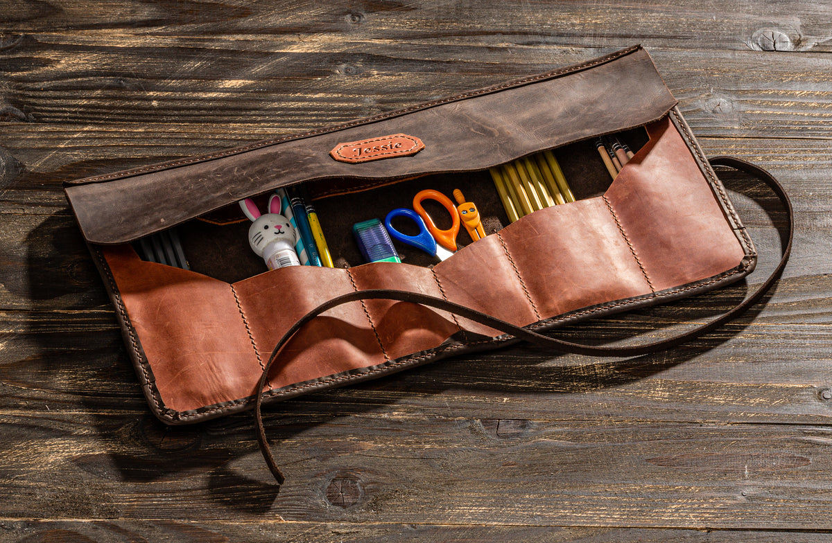 Personalized copper and dark brown leather artist tool roll with pockets for pencils, brushes and scissors