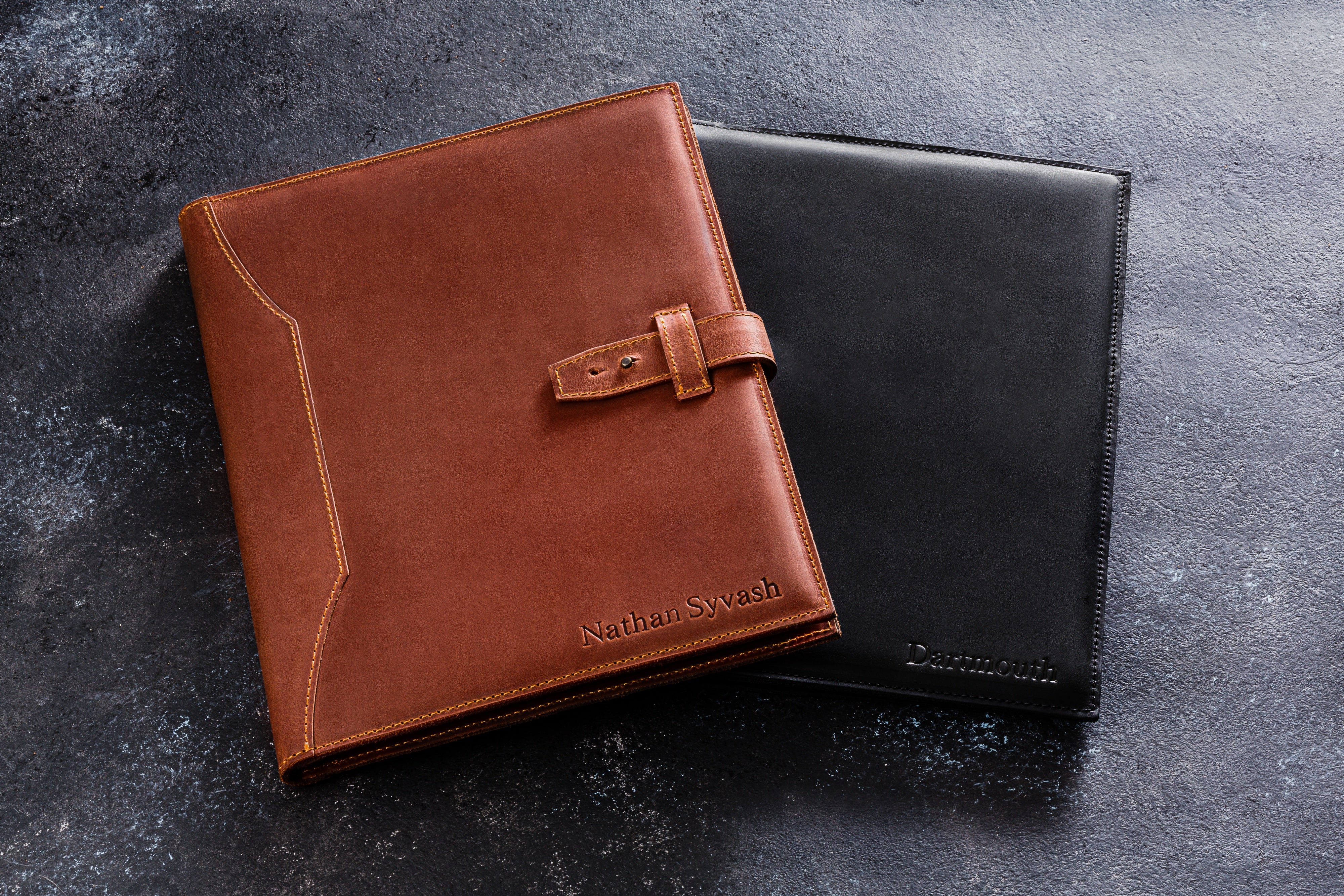 Light brown leather portfolio Mureli with legal pad and pen on desk