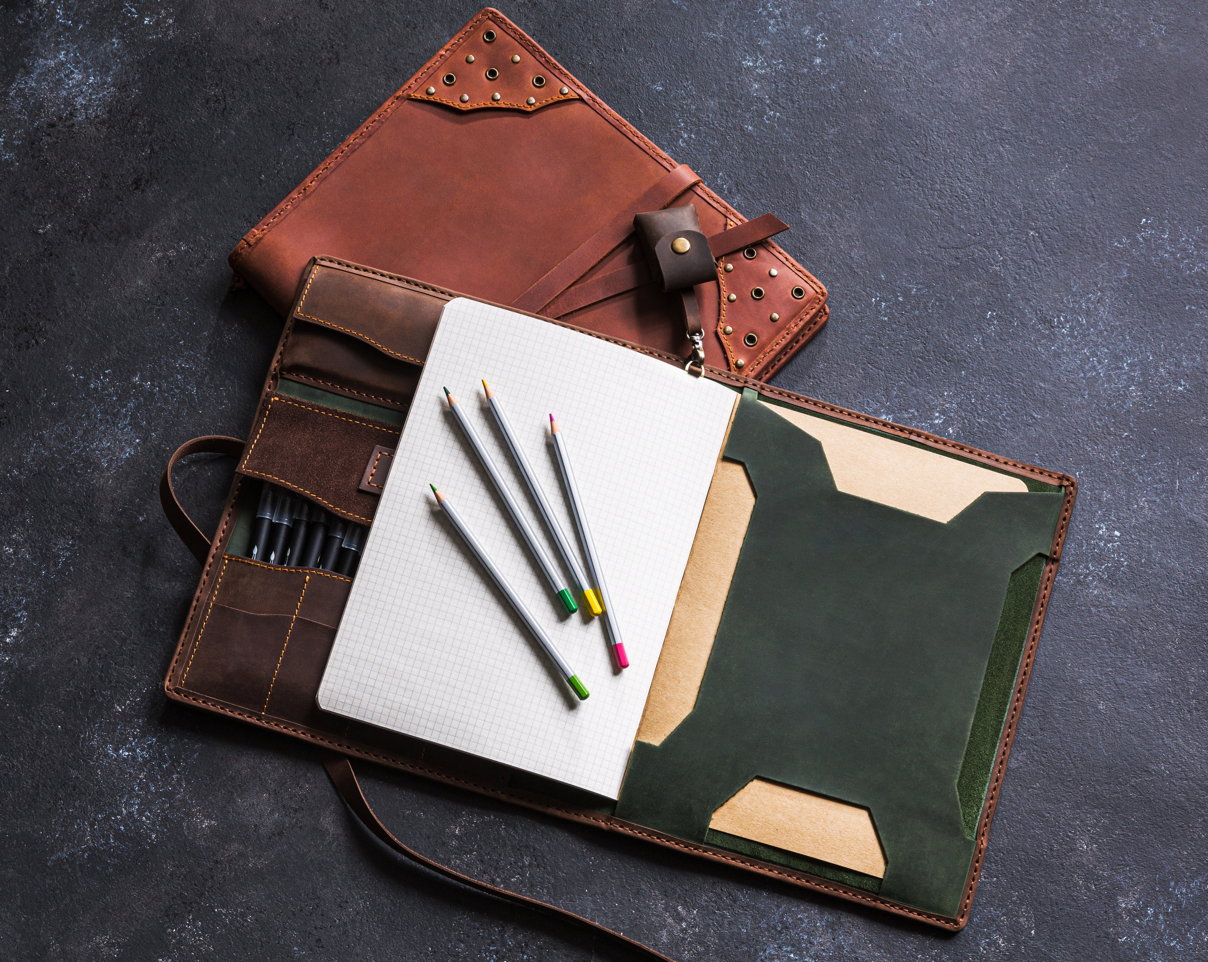 Sketchbook organizer with leather loop for pencils
