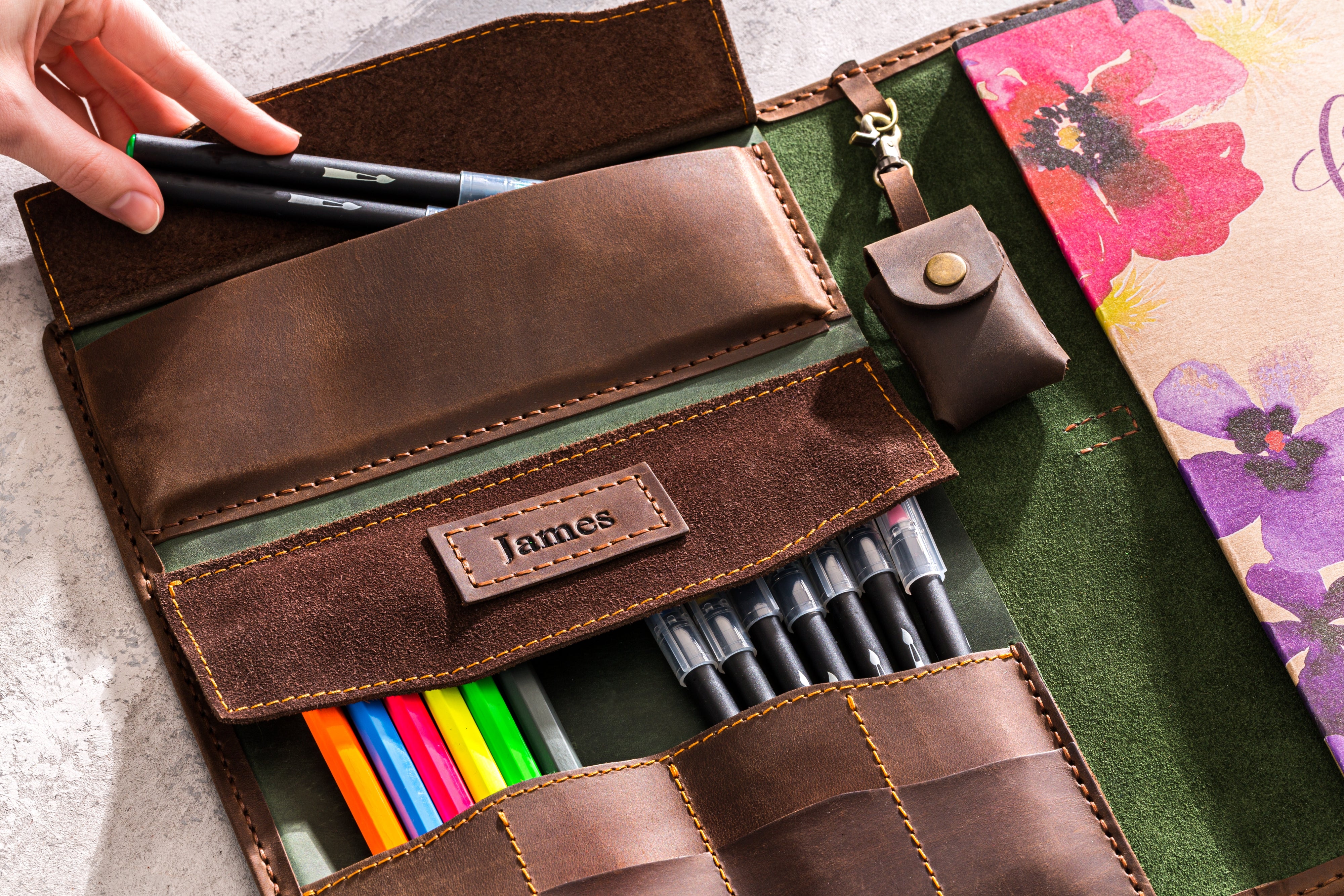 Refillable sketchbook inserted in leather case