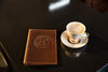 Leather menu cover showing stitched edge and folded A5 insert