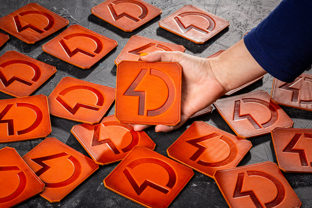 Mureli Workshop branded leather coasters, custom square shape for business gifts