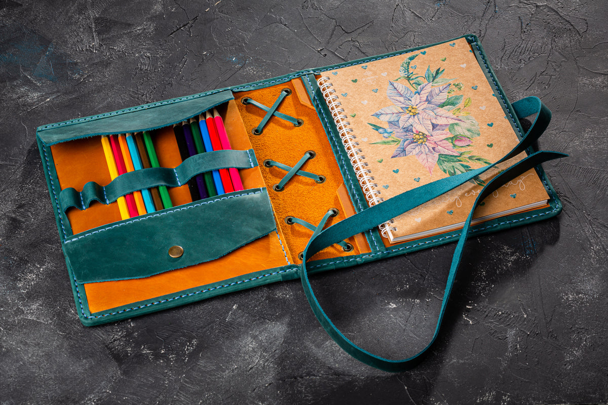 Personalized wheat yellow and teal leather sketchbook cover with pencil holder and wrap closure