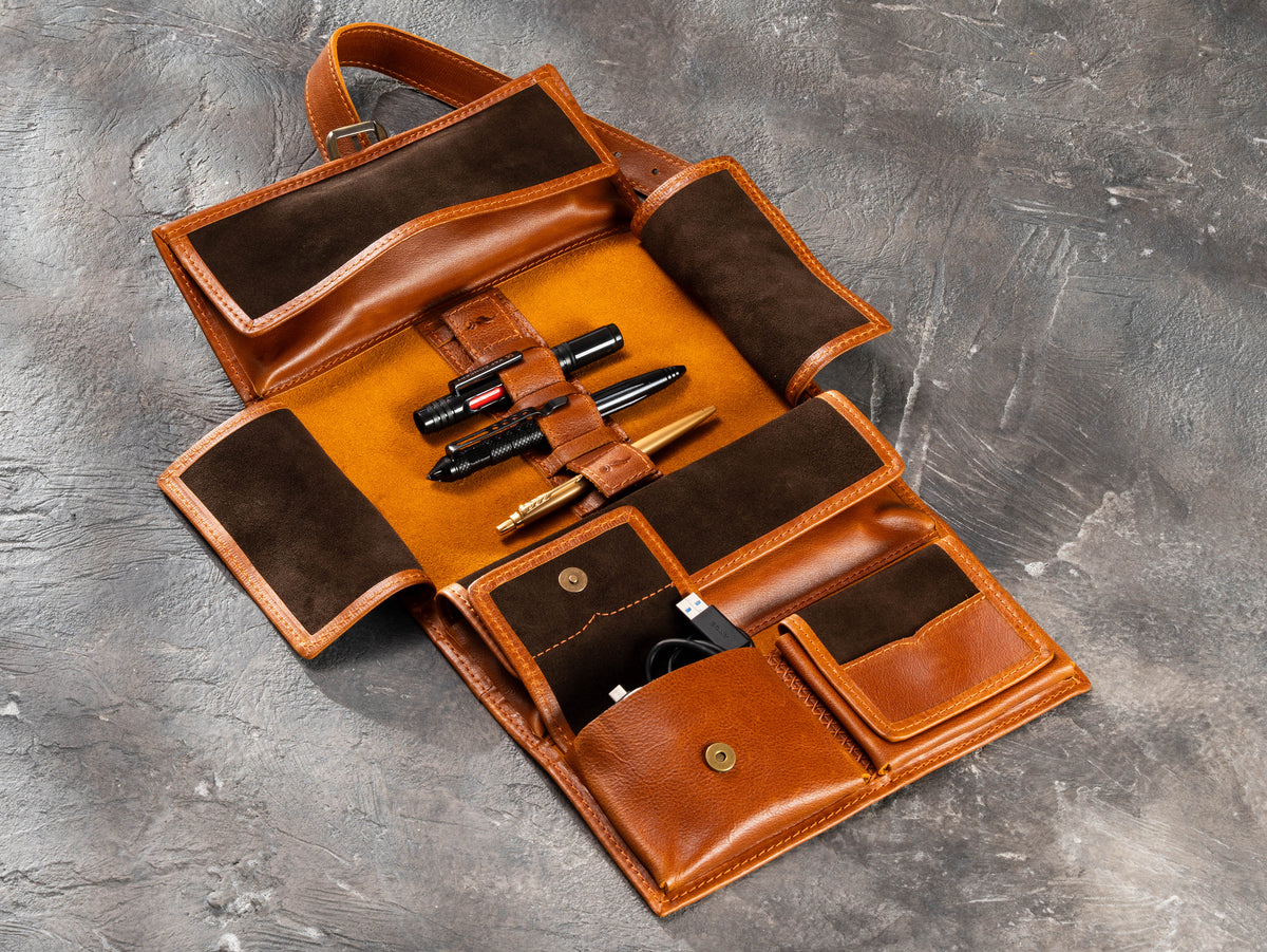 Camel leather hanging roll-up travel organizer with pen loops, magnetic pockets and storage for travel accessories