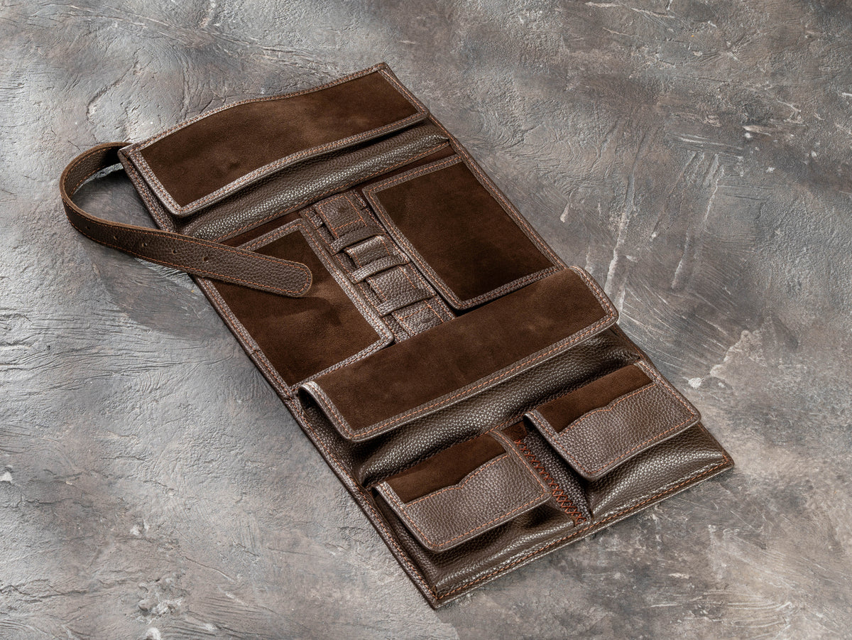 Open Chocolate Brown roll-up leather travel organizer with closed magnetic pockets and interior compartments