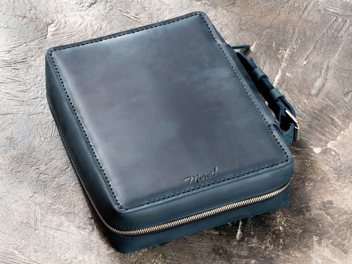 Closed Deep Blue leather travel organizer case with zip-around closure, carry handle and hand-stitched leather edges