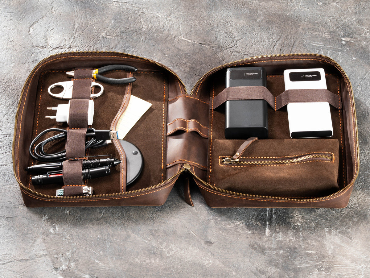 Milk Chocolate Brown zippered leather travel organizer filled with chargers, cables, tools and travel essentials