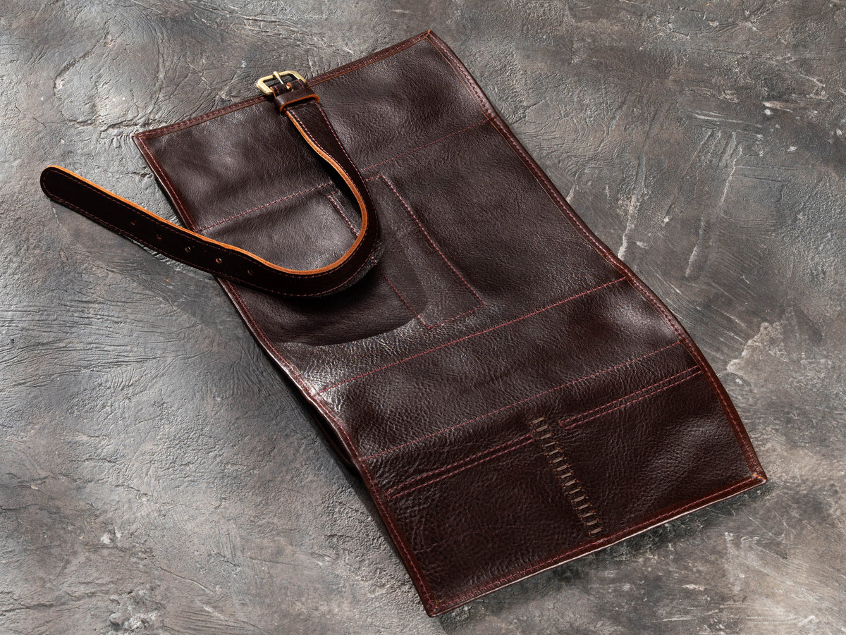 Open Dark Brown leather travel organizer showing magnetic pockets, suede lining and organized interior