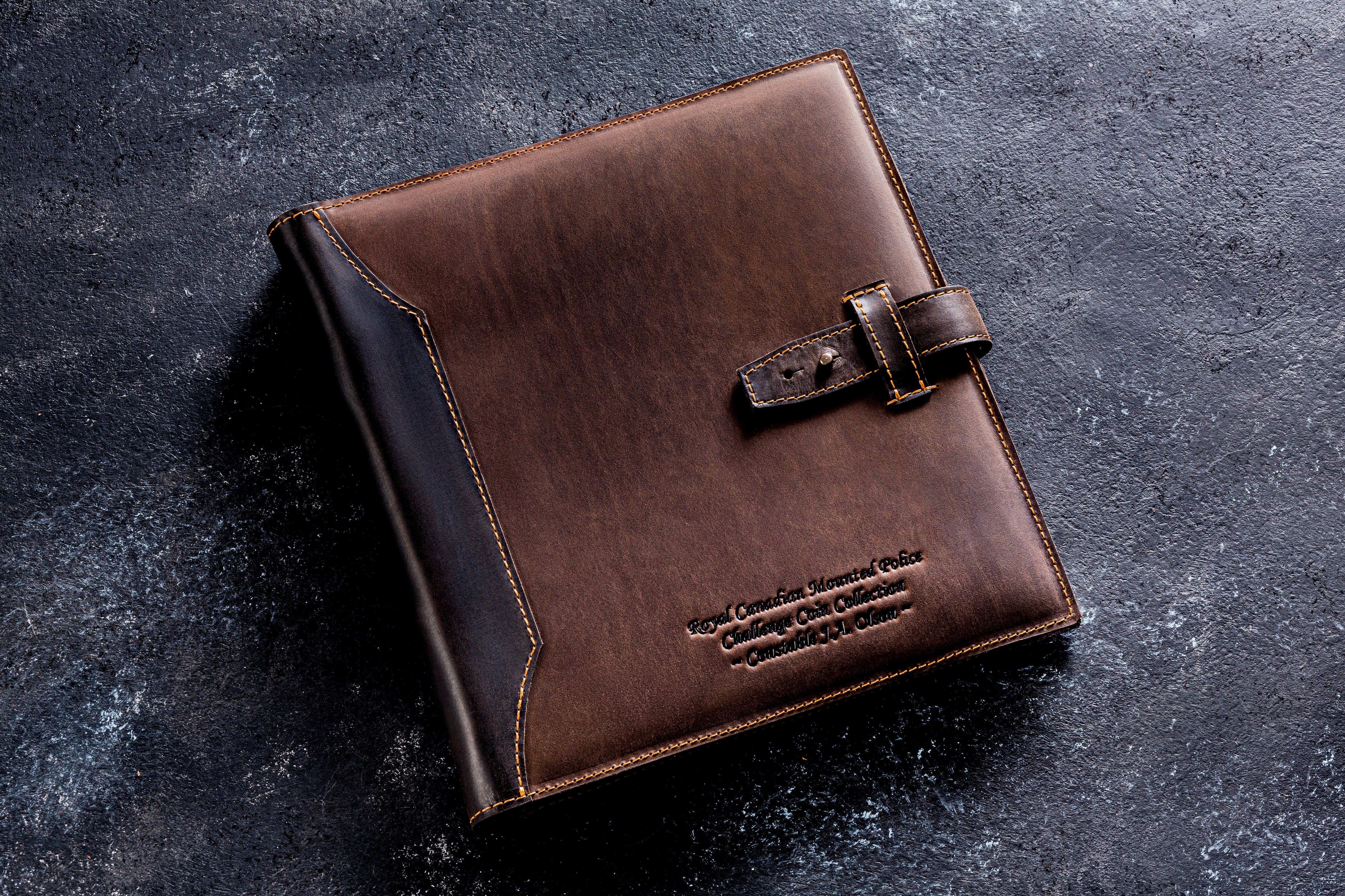 Handcrafted personalized leather coin collection album with 10 sheets and 200 pockets. Professional numismatic folder in 9 leather colors including brown, green, and navy blue. Custom embossed name on premium leather cover. High-quality gift for coin collectors.