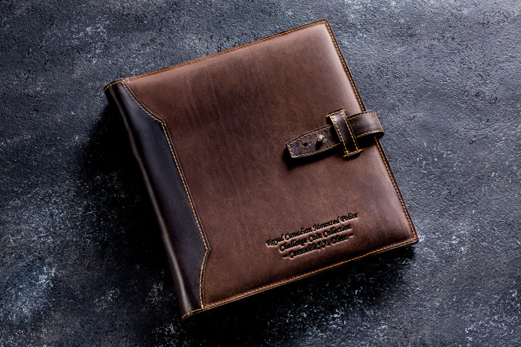 Handcrafted personalized leather coin collection album with 10 sheets and 200 pockets. Professional numismatic folder in 9 leather colors including brown, green, and navy blue. Custom embossed name on premium leather cover. High-quality gift for coin collectors.