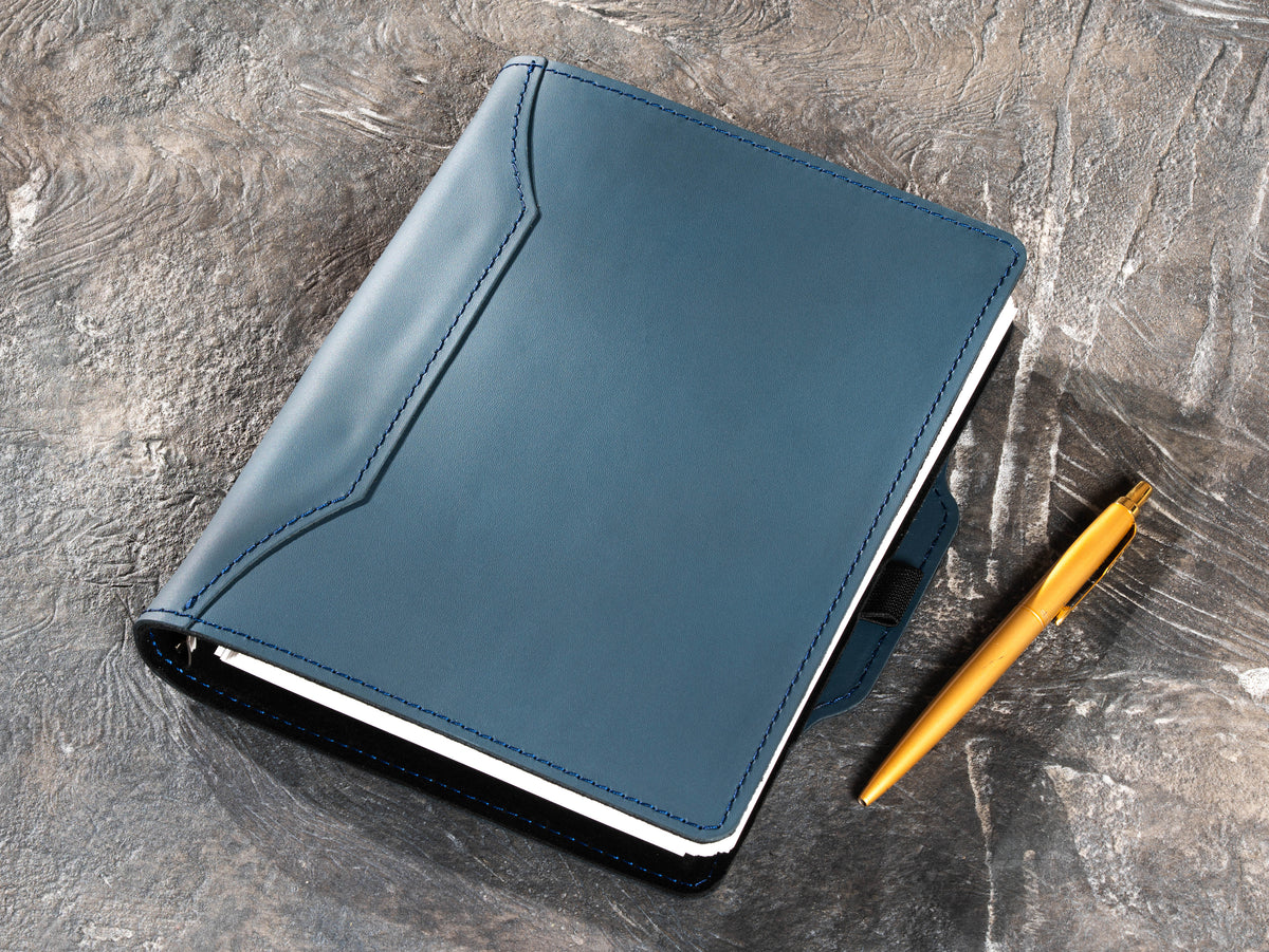 Slate Blue corporate leather notebook with gold pen shown for presentation