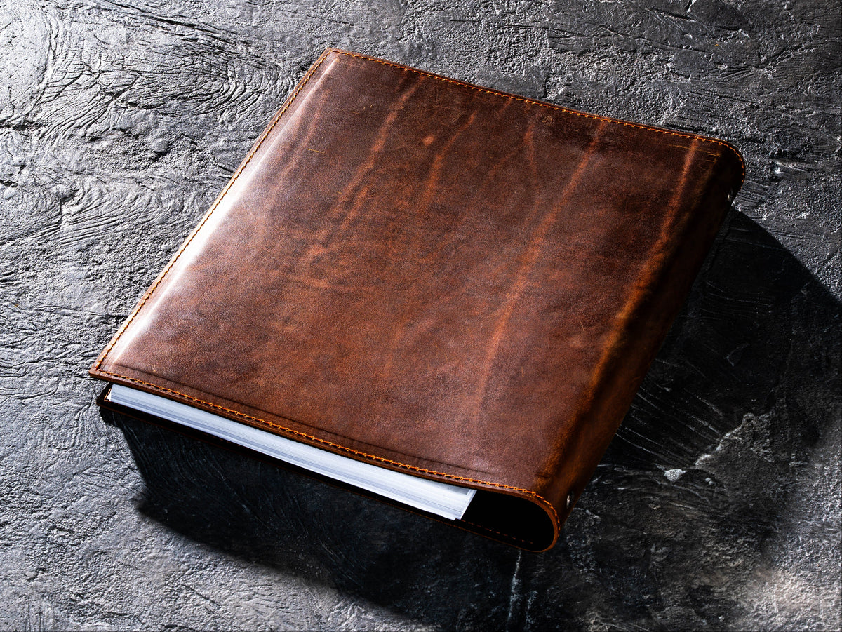 Back view of Chestnut Crazy Horse leather 3-ring binder showing natural leather texture and stitching