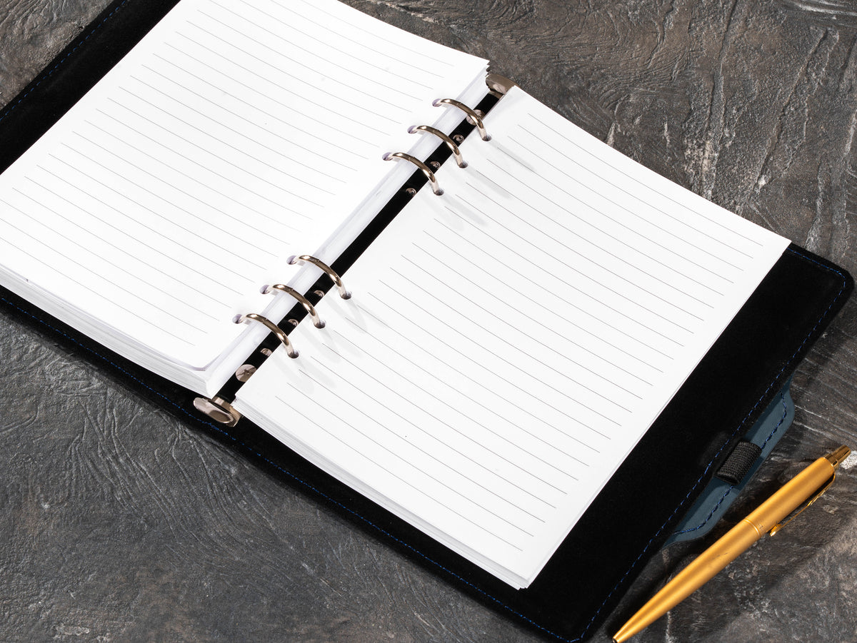 Open Slate Blue A5 leather notebook with six-ring mechanism and lined refill pages