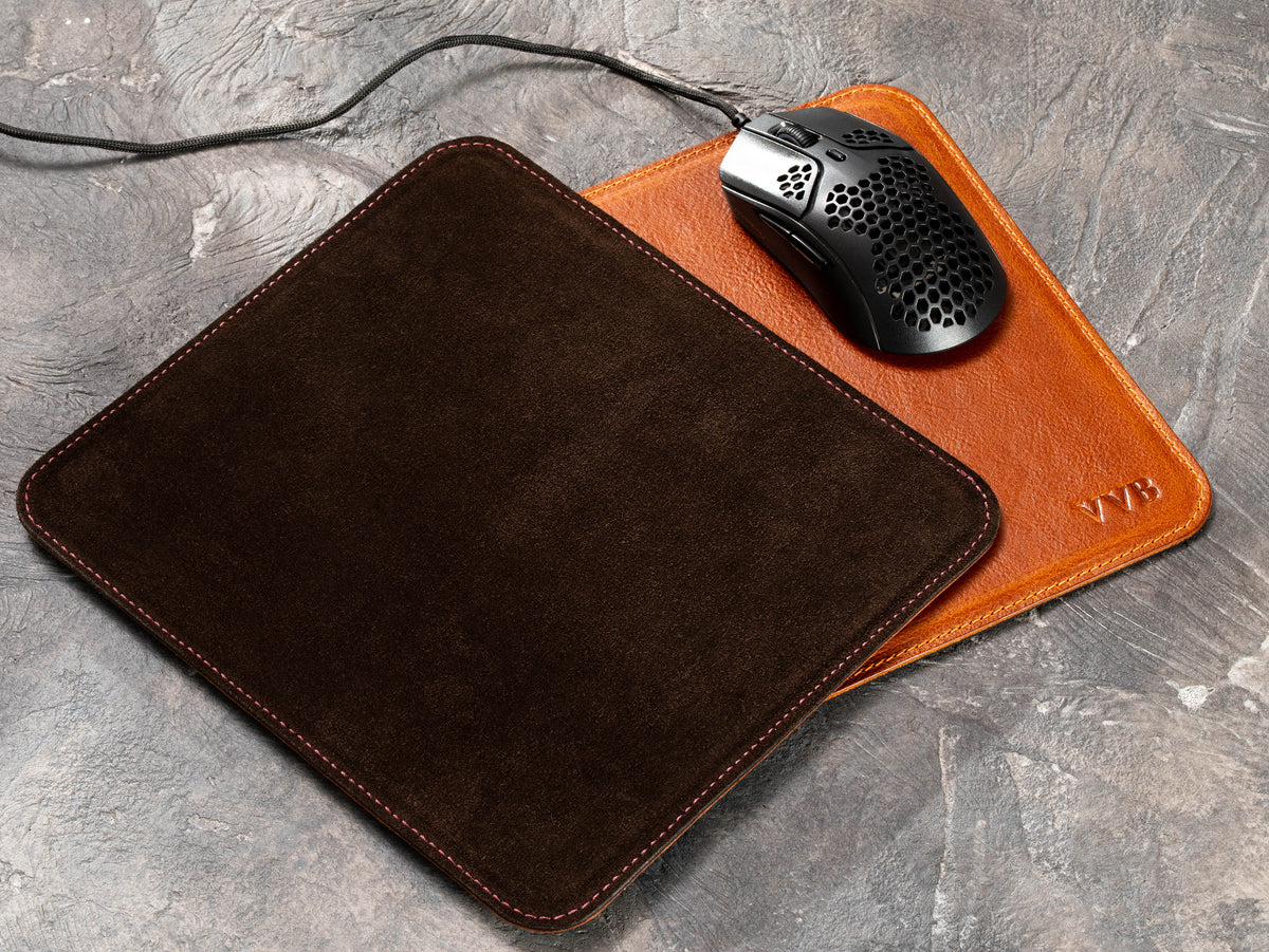 Leather mouse pad with dark brown non-slip suede backing beside Camel personalized mouse mat