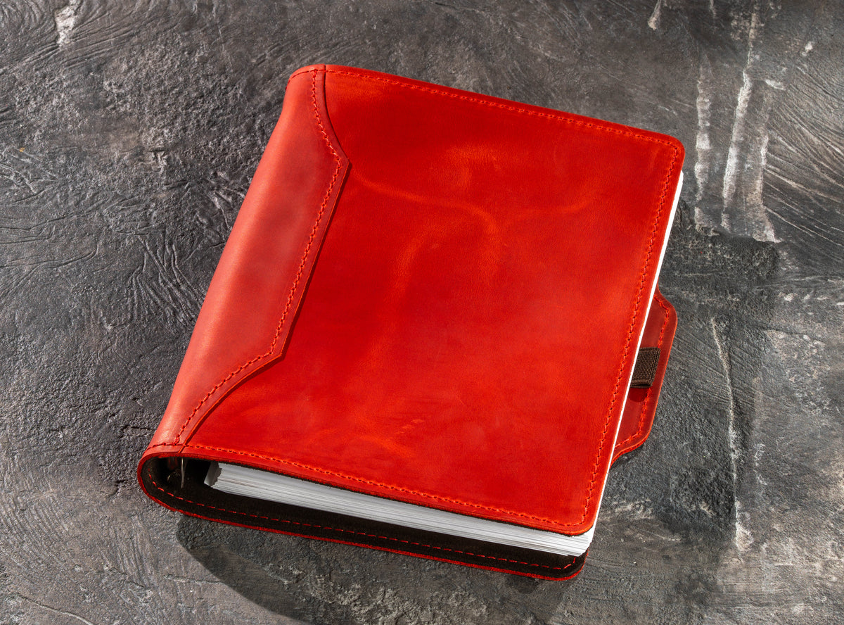 Red personalized leather business notebook for A5 and 8.5 x 5.5 pages on dark background