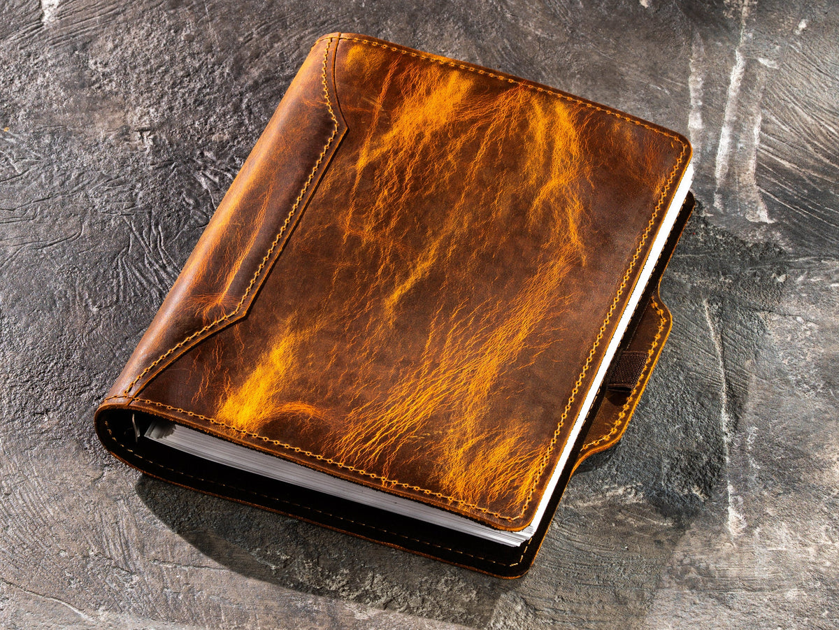 Chestnut Crazy Horse leather notebook showing strong pull-up effect after flexing the leather