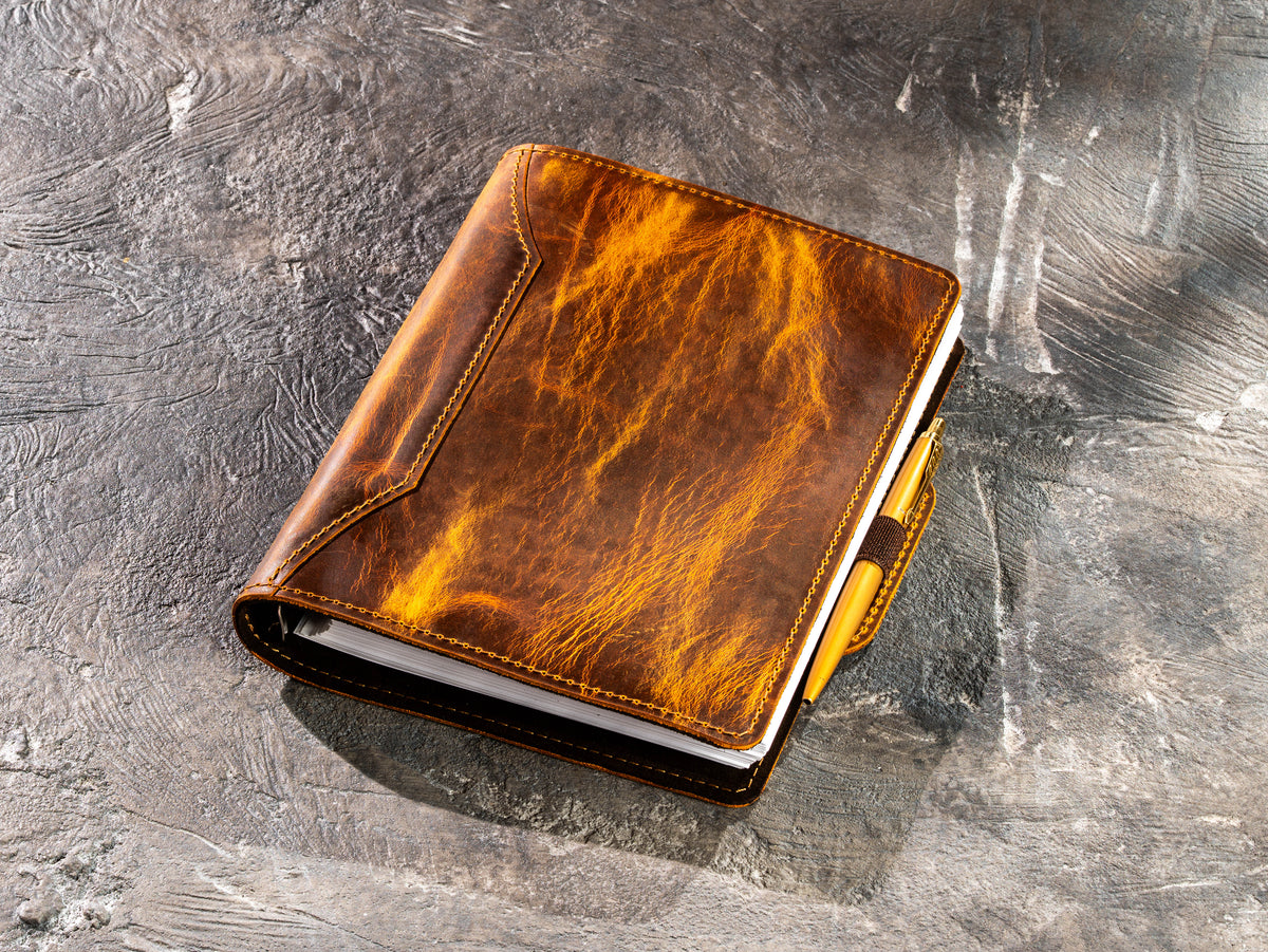 Chestnut Crazy Horse leather business journal with gold pen secured in elastic pen loop