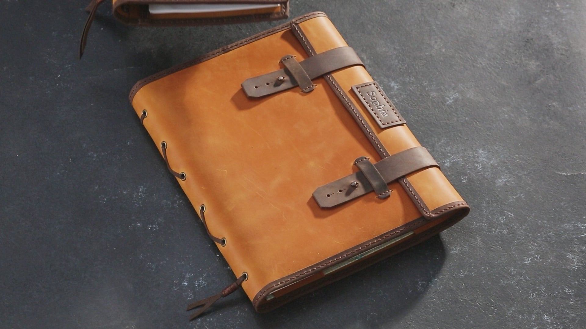 Personalized dark brown artist organizer made of Crazy Horse leather, closed with straps — perfect creative gift from Mureli