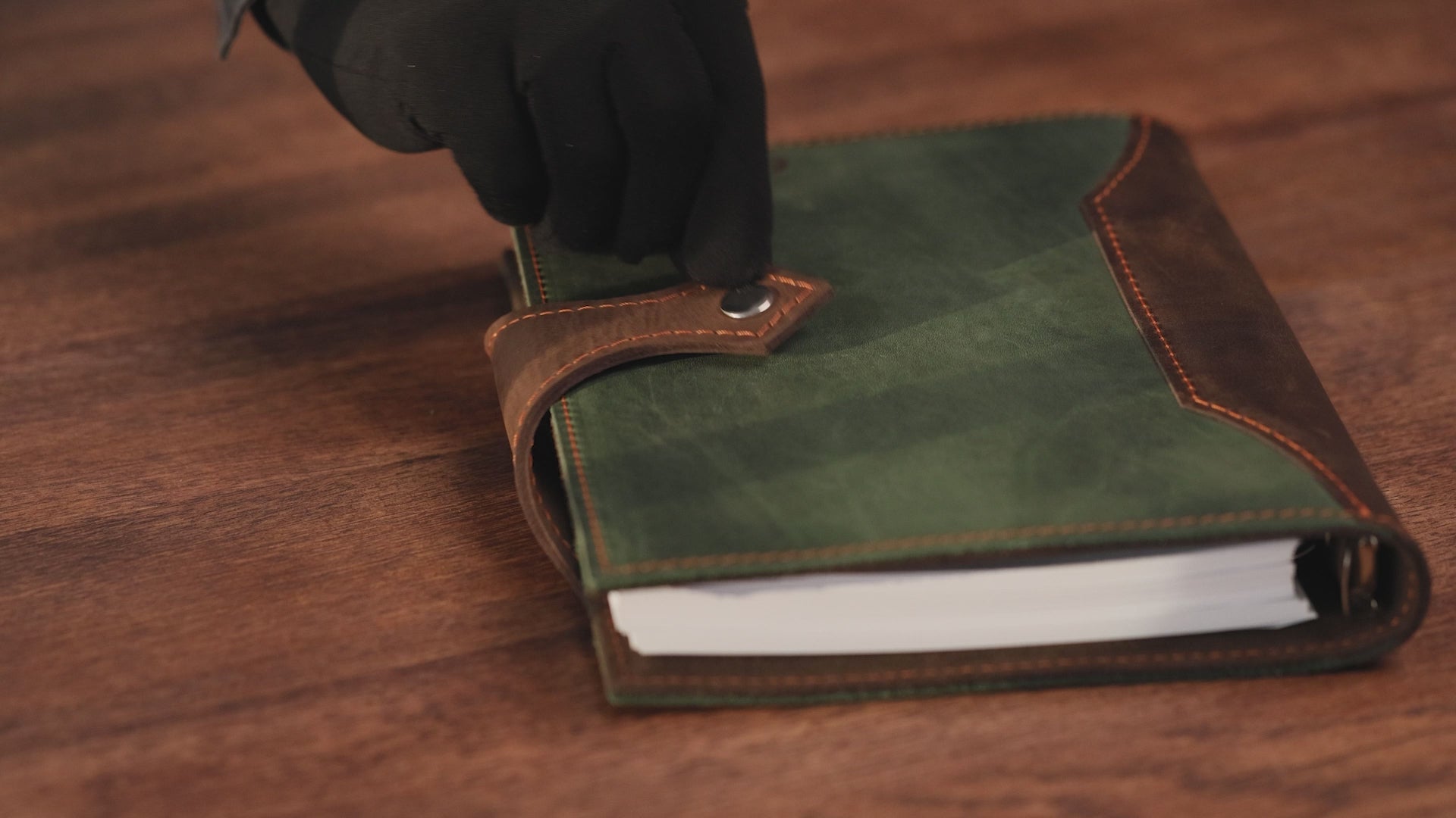 Handcrafted full-grain brown leather planner with stitched closure detail