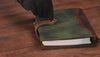 Handcrafted full-grain brown leather planner with stitched closure detail