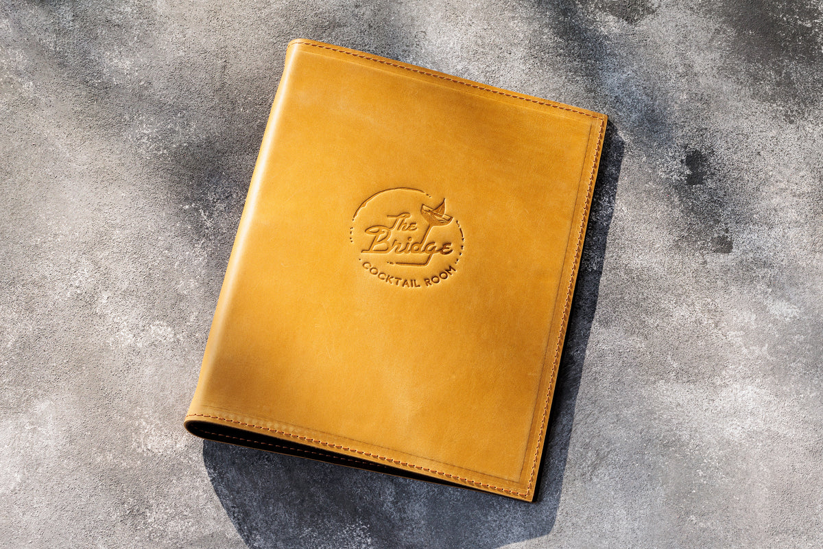 Golden yellow leather 3-ring restaurant menu binder with personalized embossed logo